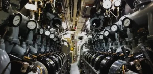 View of the inside of a submarine with the engine and pressure gauge
