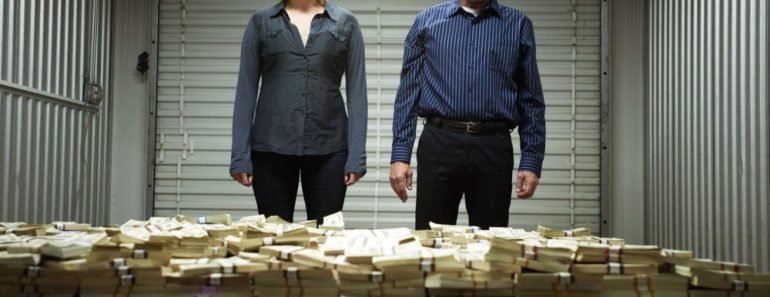 Breaking bad scene where Walter White and Skylar stand in front of a huge pile of cash 770x297 1