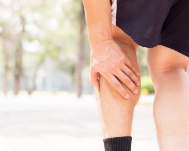 Cramp in leg while exercising. Sports injury concept Narong Jongsirikul 370x297 1