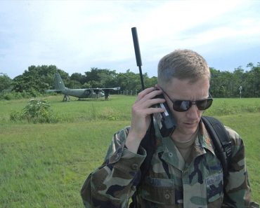 Maj. Jason Clark uses a satellite phone 370x297 1