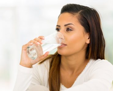 Drinking water woman 370x297 1