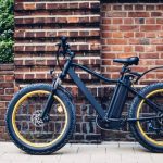 City electric bicycle near a brick wall 730x487 1