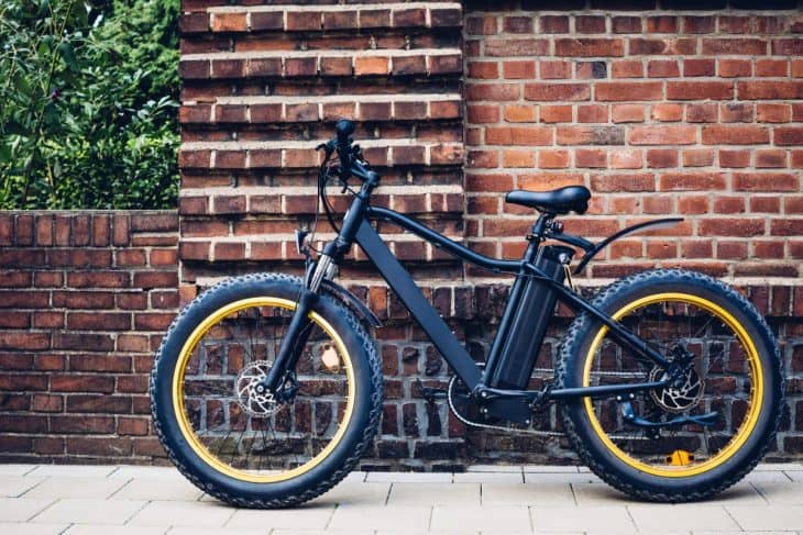 City electric bicycle near a brick wall 730x487 1