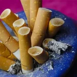 photolibrary rf photo of cigarette butts in ashtray
