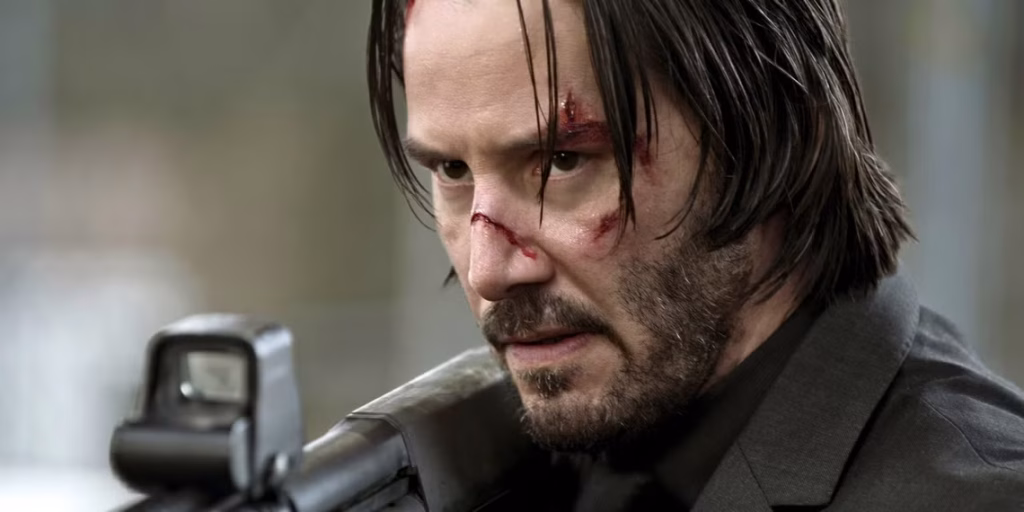 keanu reeves holding shotgun in john wick