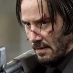 keanu reeves holding shotgun in john wick