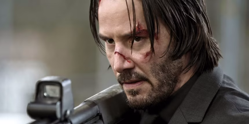 keanu reeves holding shotgun in john wick